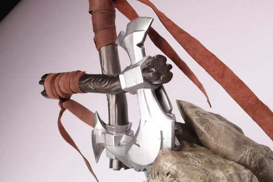 detail of the axes of the 3D printed trophy, wrapped with leather on the handles