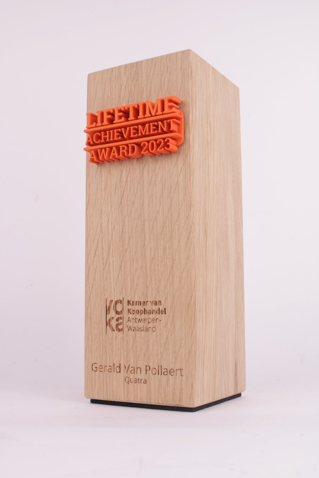 wooden trophy with an orange 3d printed template