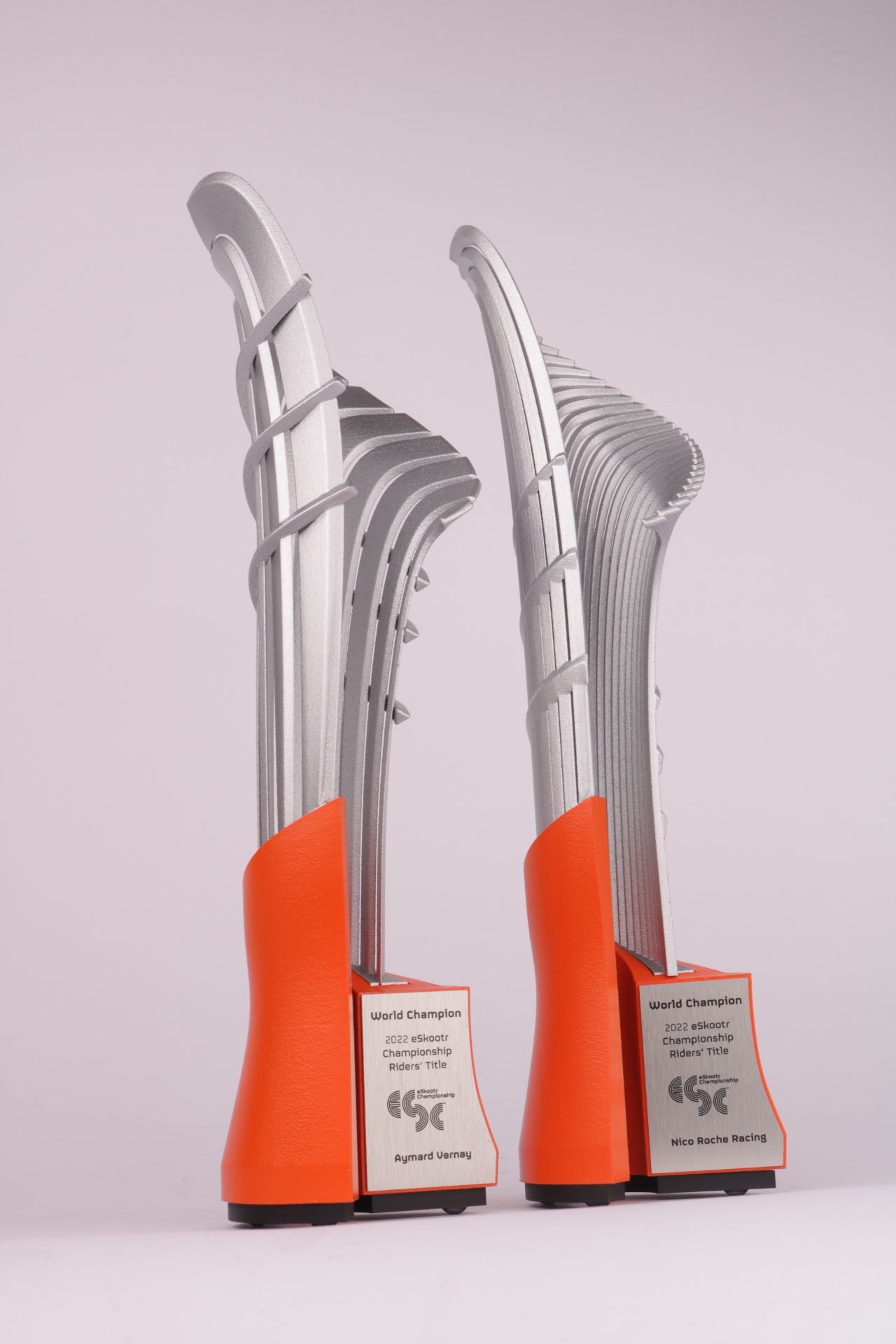 orange base with 3d printed silver trophy world champion Eskooter