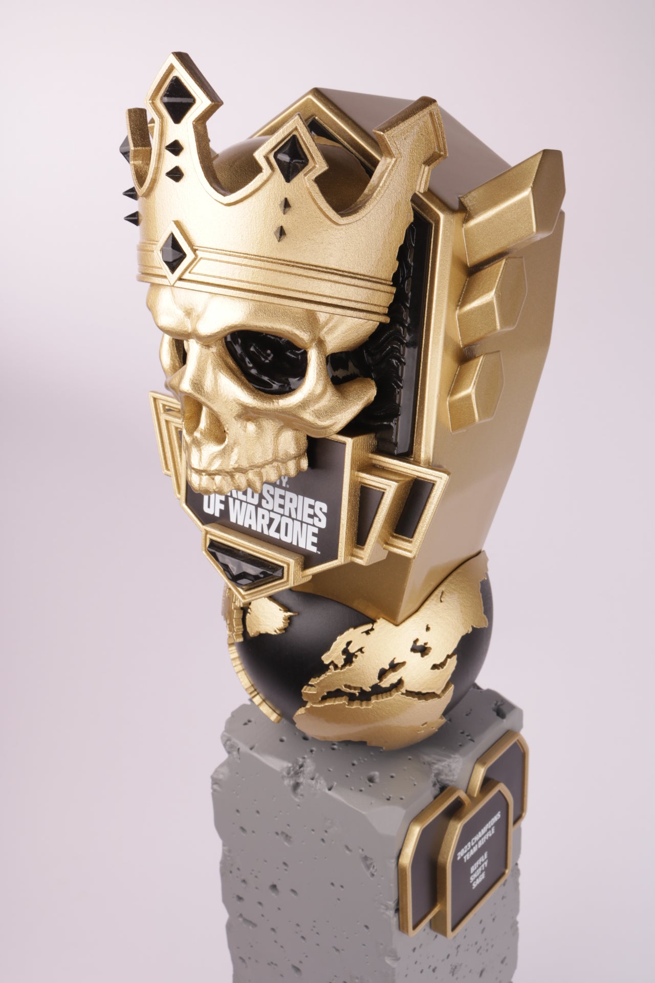concrete themed base with a gold an black world and skull for warzone