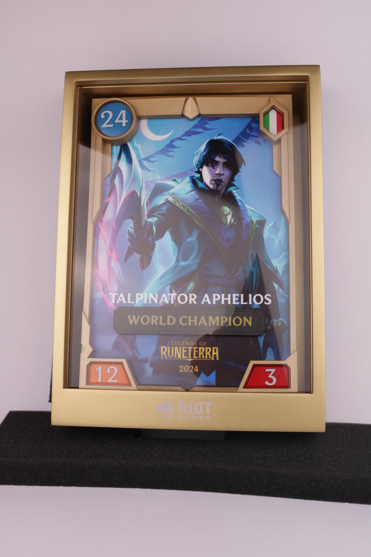 golden trophy with an image inside