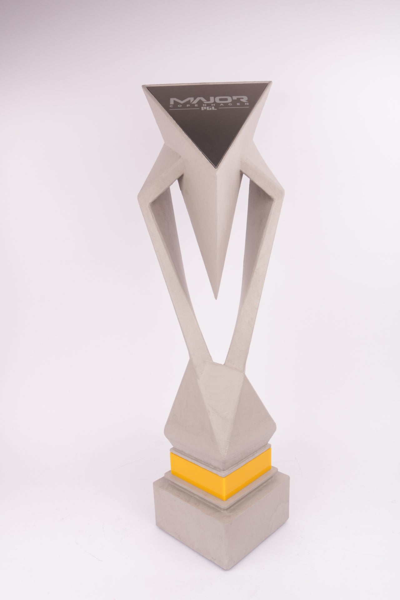 concrete trophy with a black template of major pgl on top