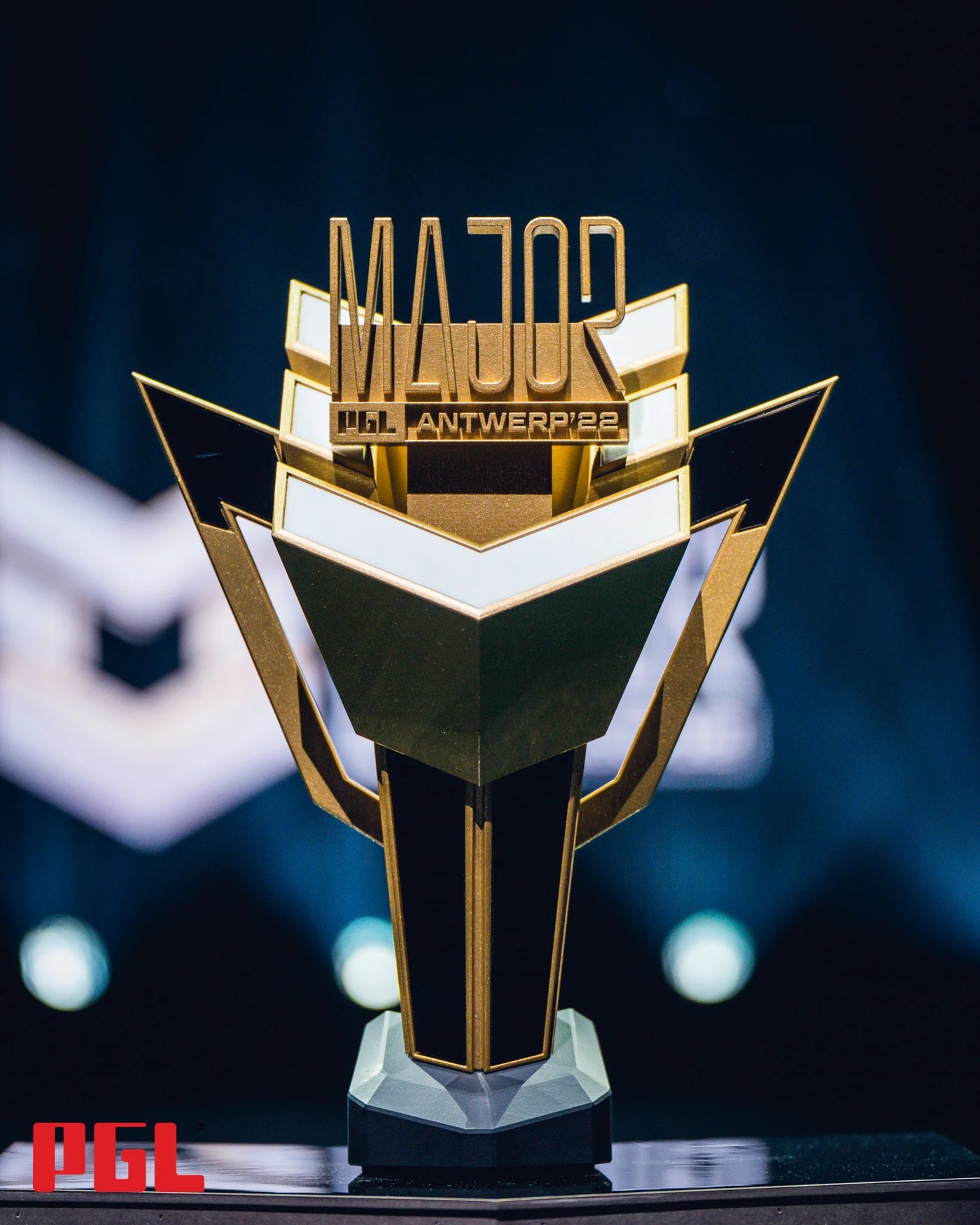 black based trophy with a golden trophy, for the major pgl championship