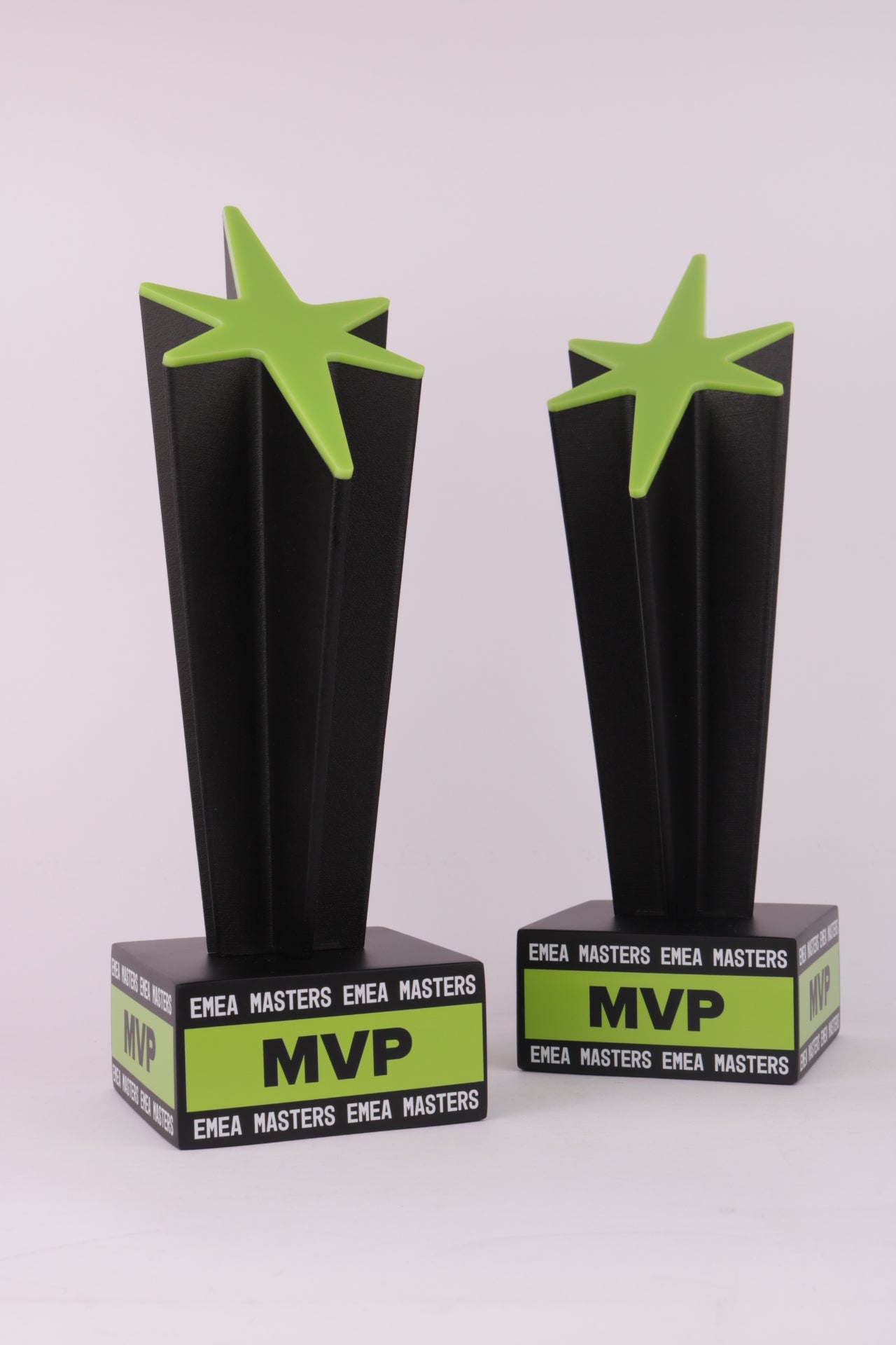black and green trophy stand with a black 3dprinted trophy