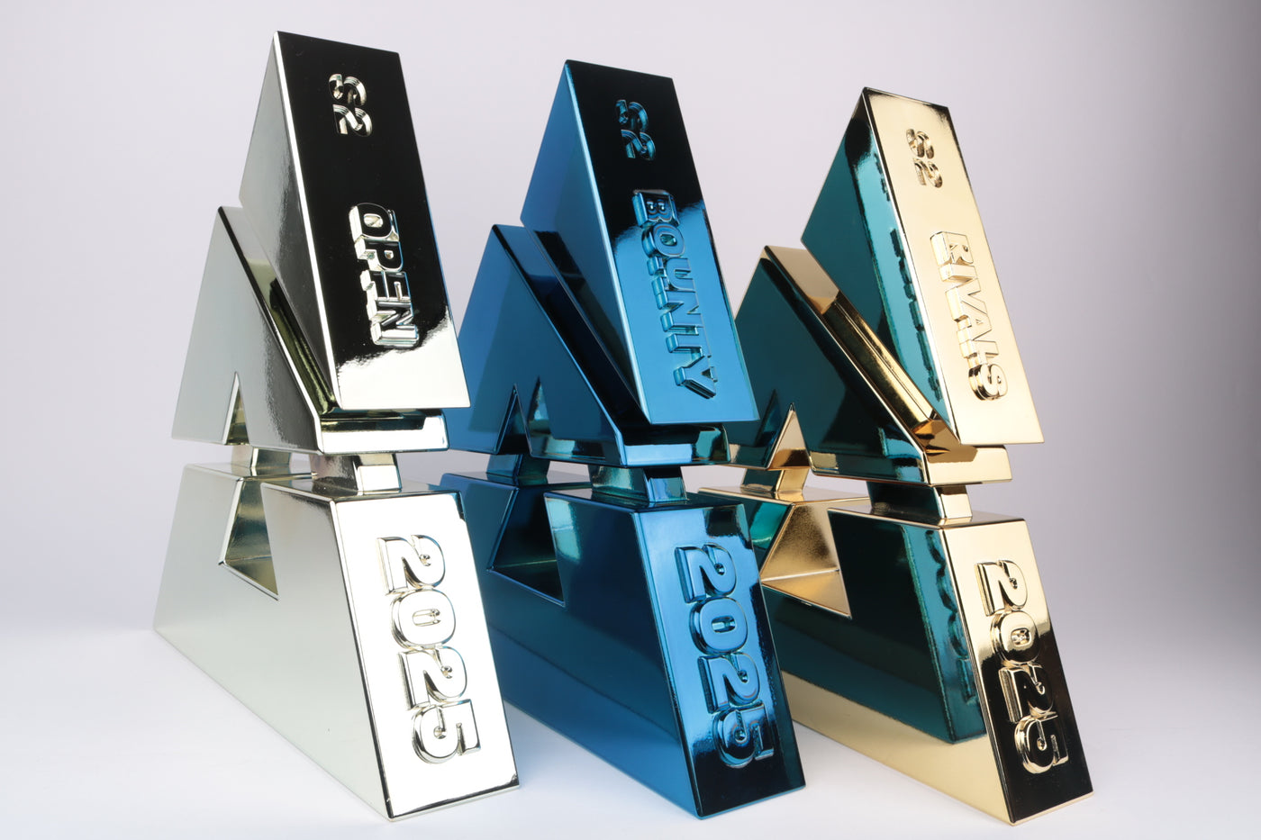 three chrome trophies for blast premier gold silver and blue