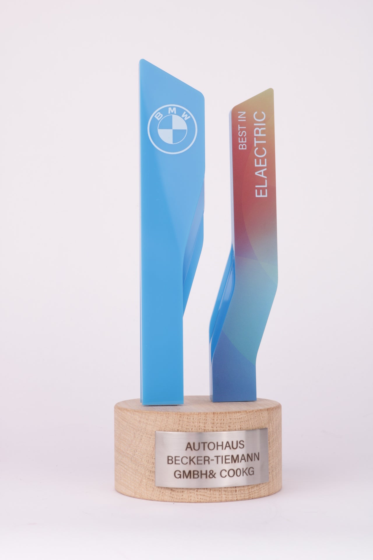 wooden base with a 3d printed colorful trophyfor bmw