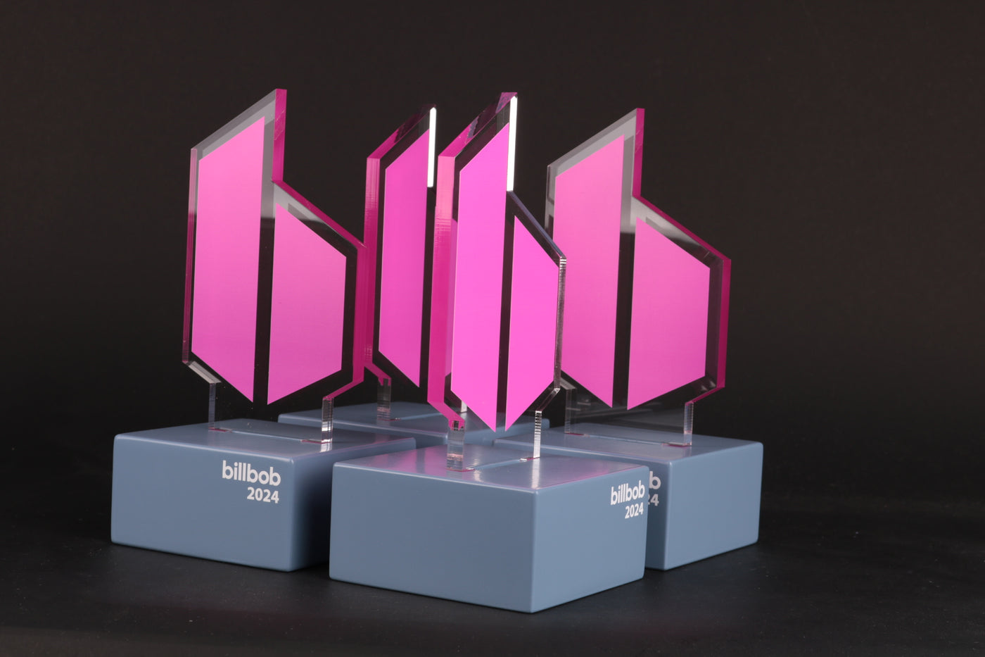 grey trophy stand with a pink acrylic trophy for billbob