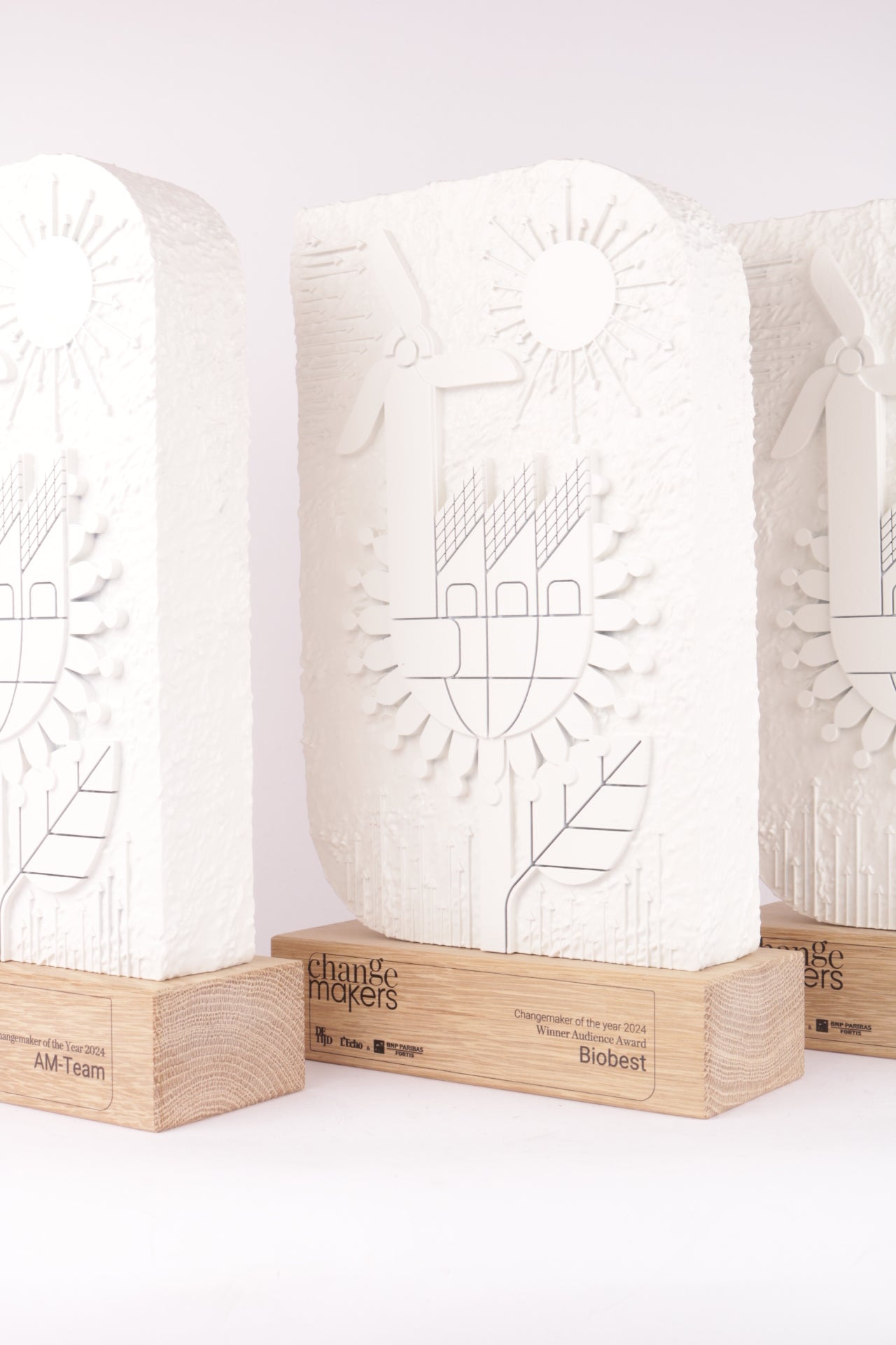 wooden trophy stand with a concrete template for change makers