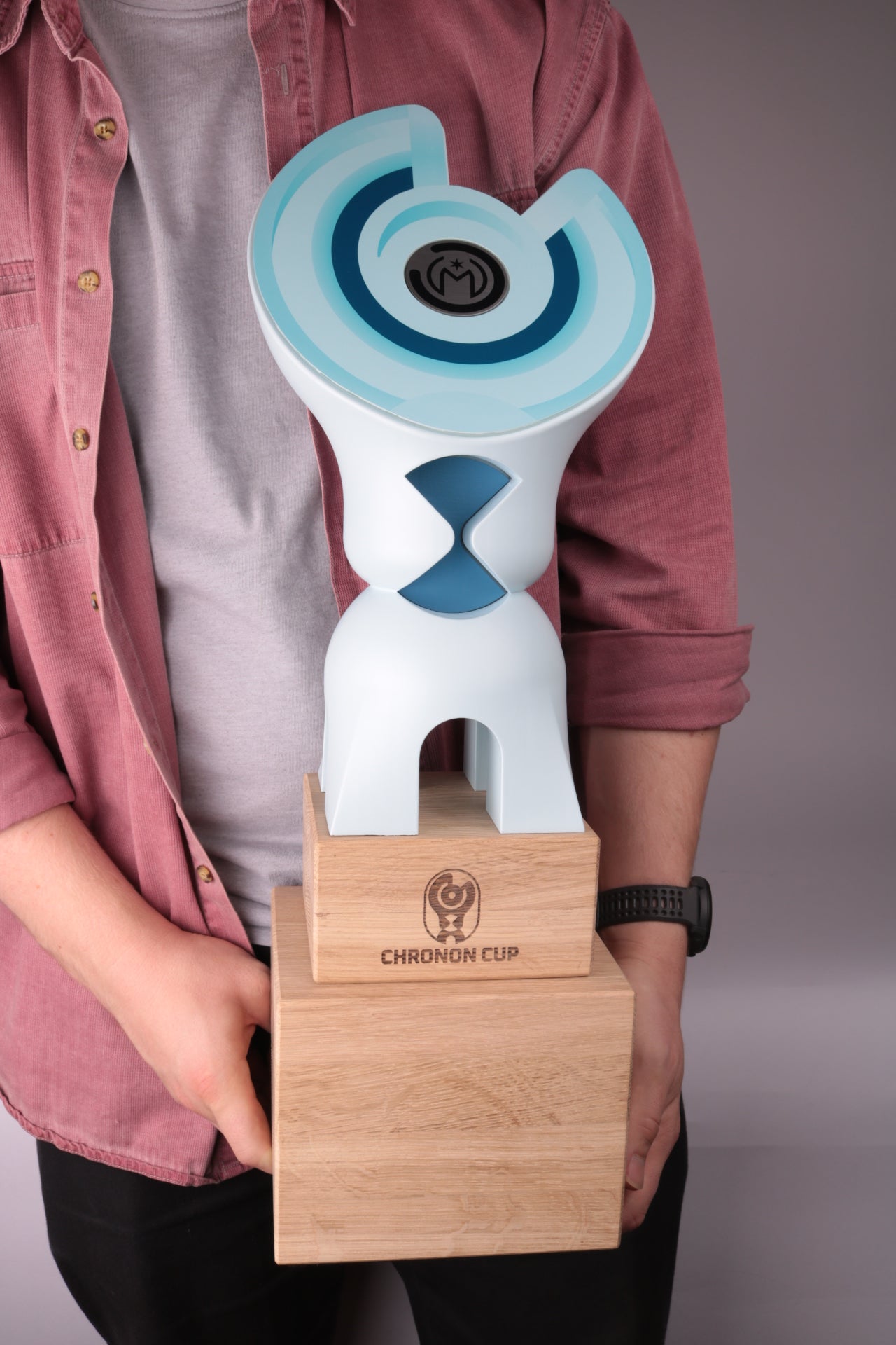 wooden base with a blue 3d printed trophy