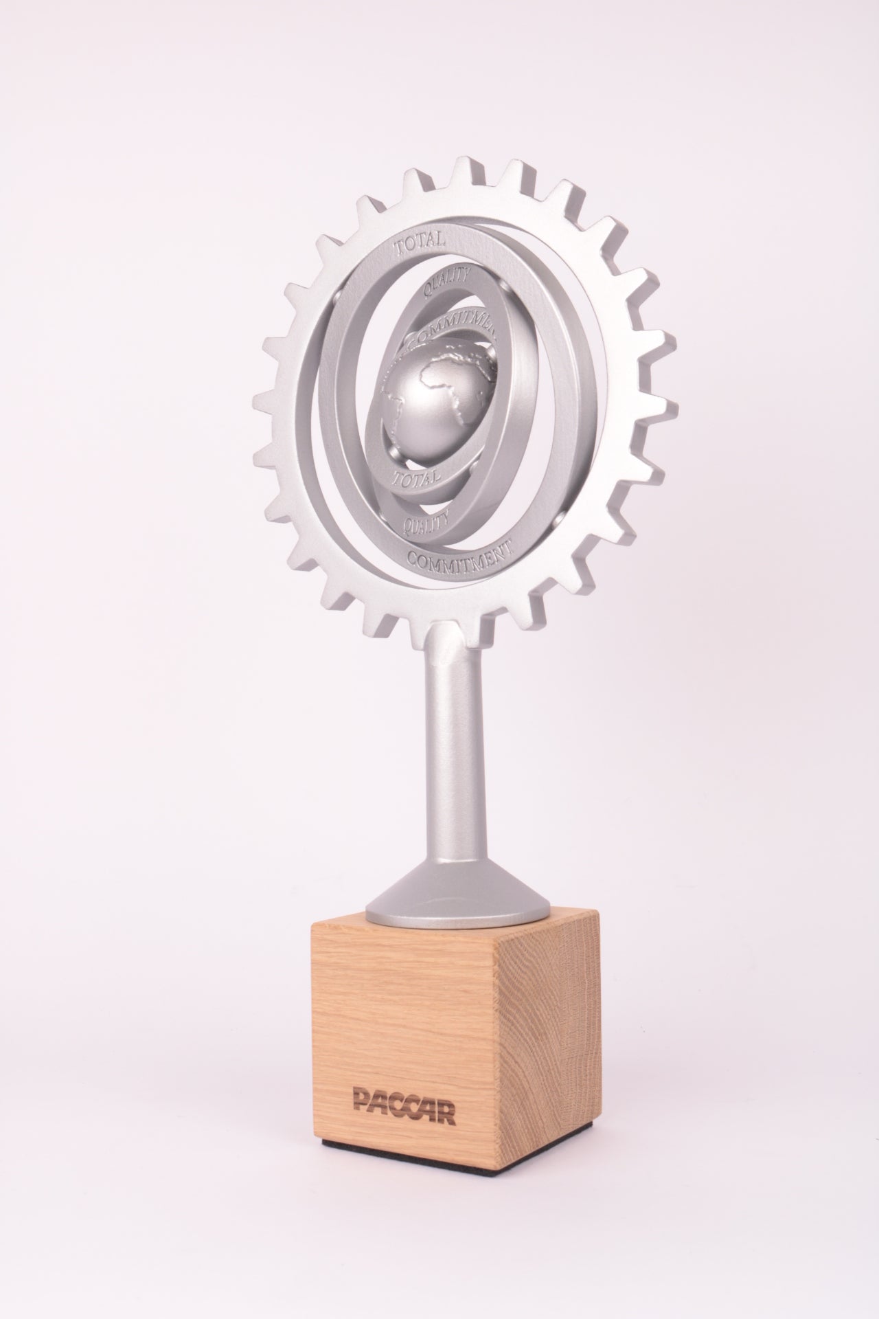 wooden trophy stand with an aluminium looking 3d printed trophy