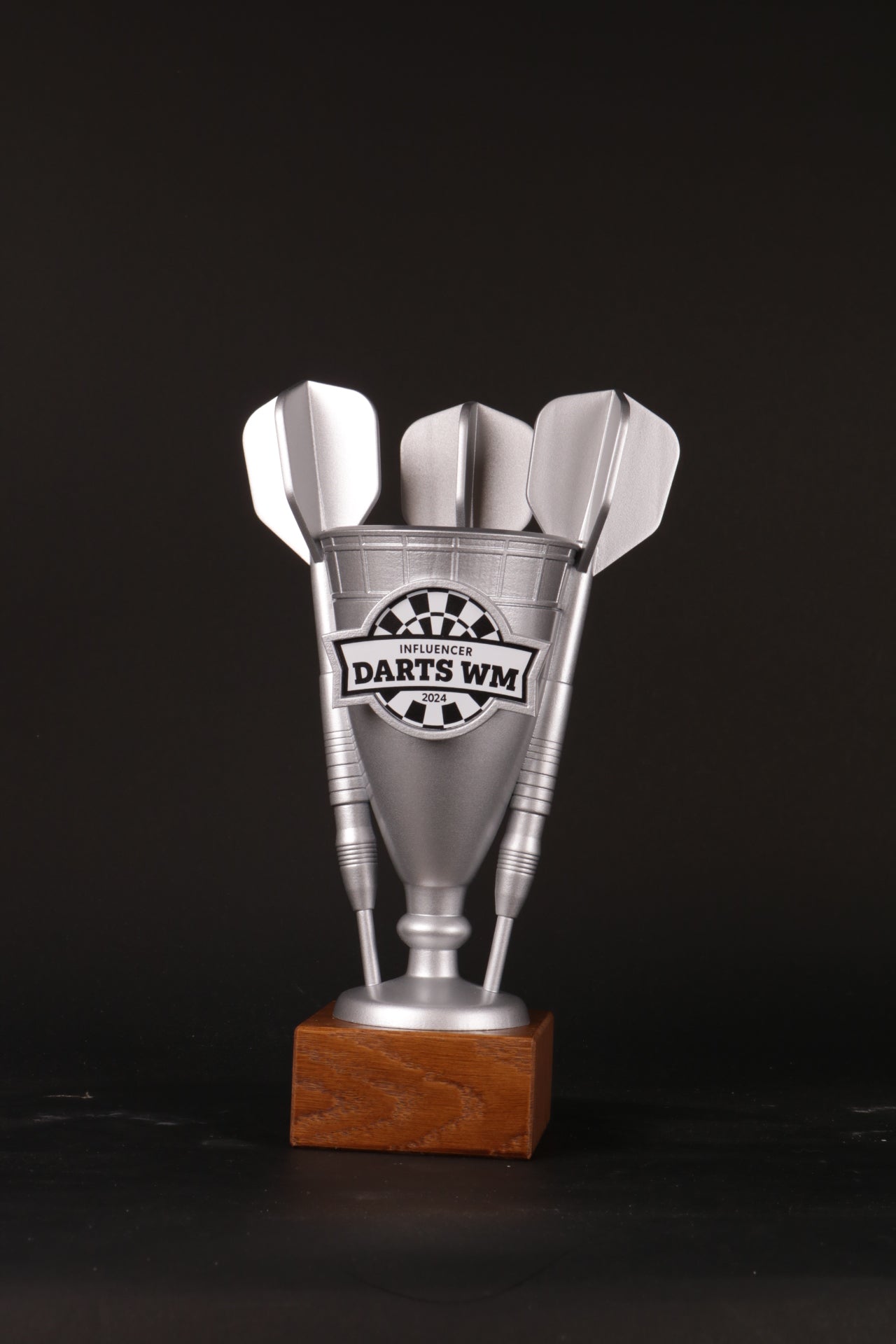 wooden base with 3d printed trophy, a custom trophy for a darts tournament