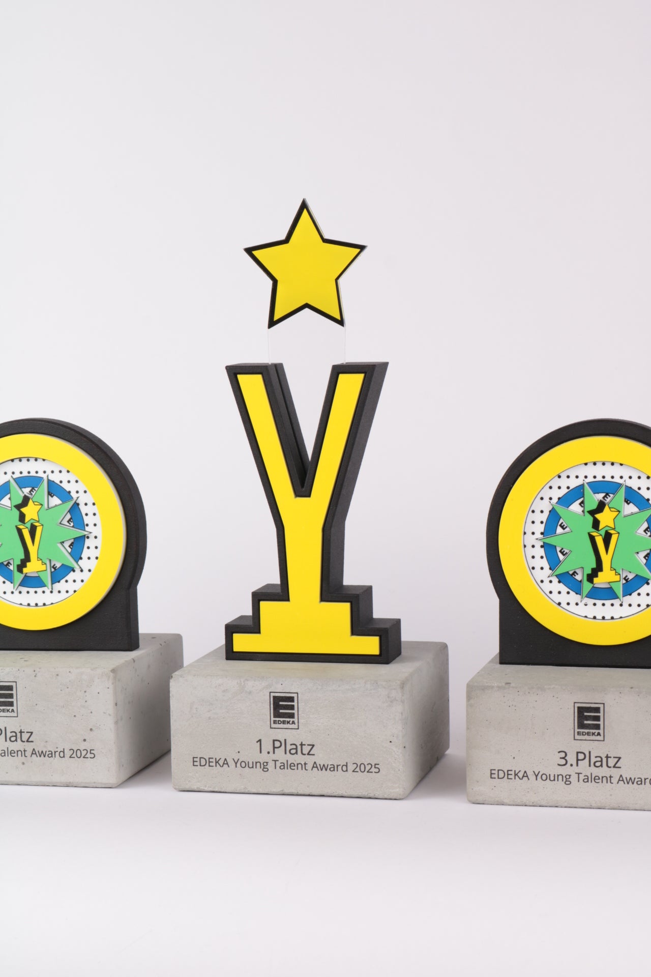 edeka Y trophy on concrete base with acrylic colourful pop art graphics and a star