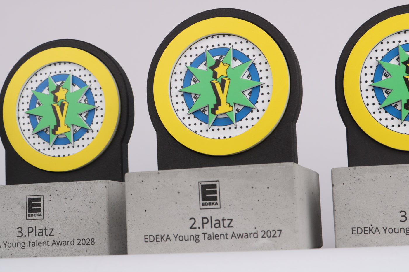 edeka round trophy on concrete base with acrylic colourful pop art graphics