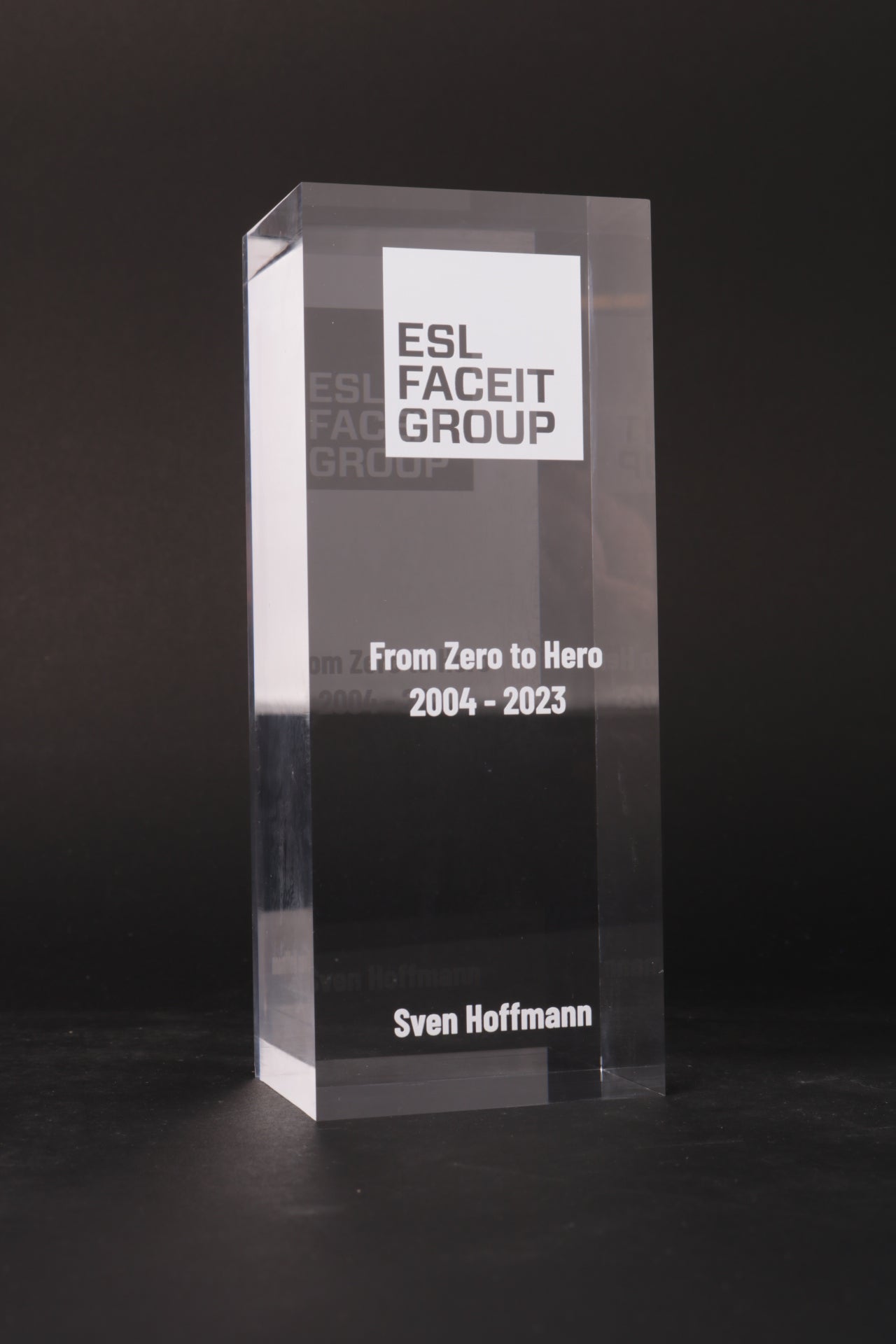 glass trophy with an acrylic logo
