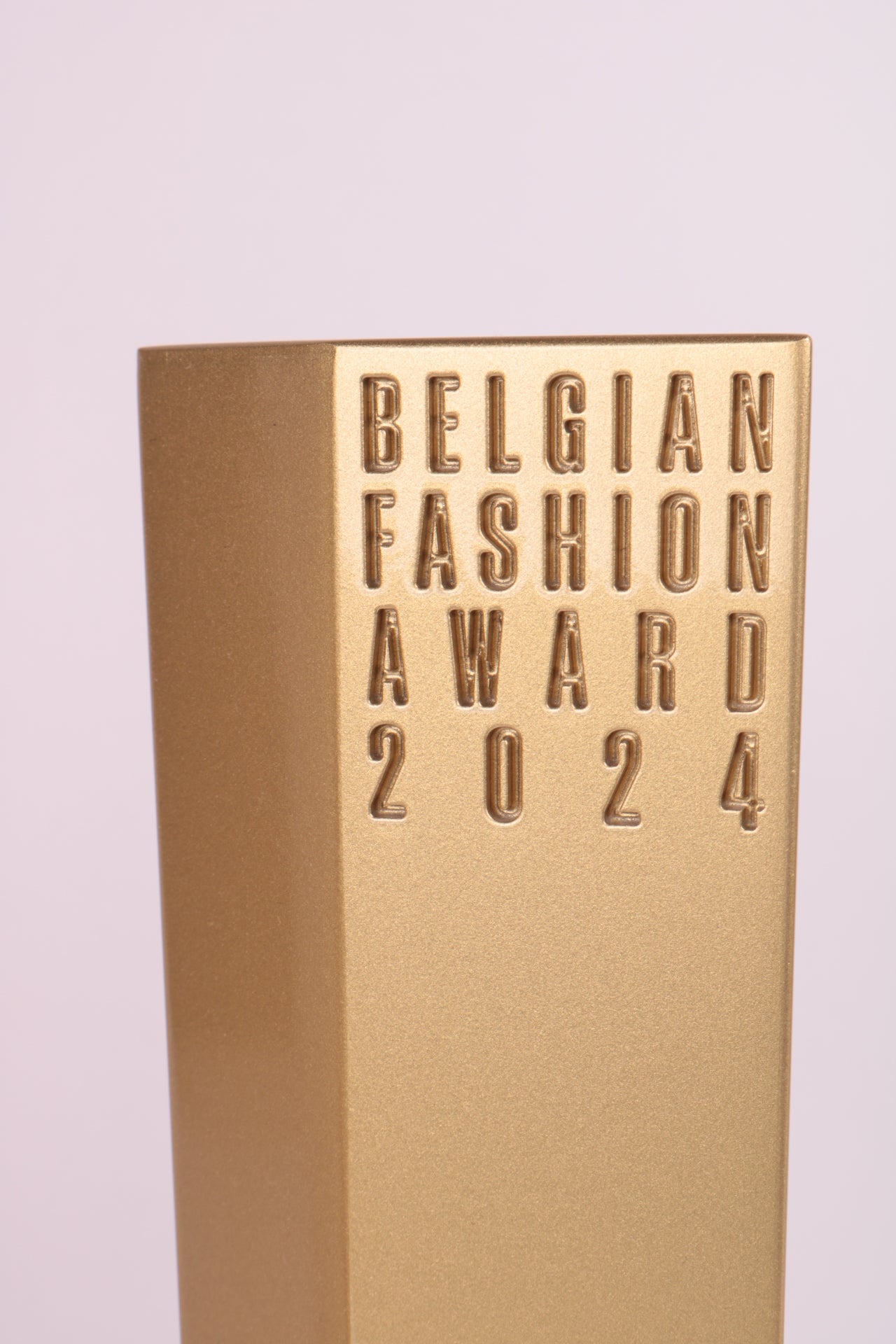 golden trophy with "belgian fashion award 2024"