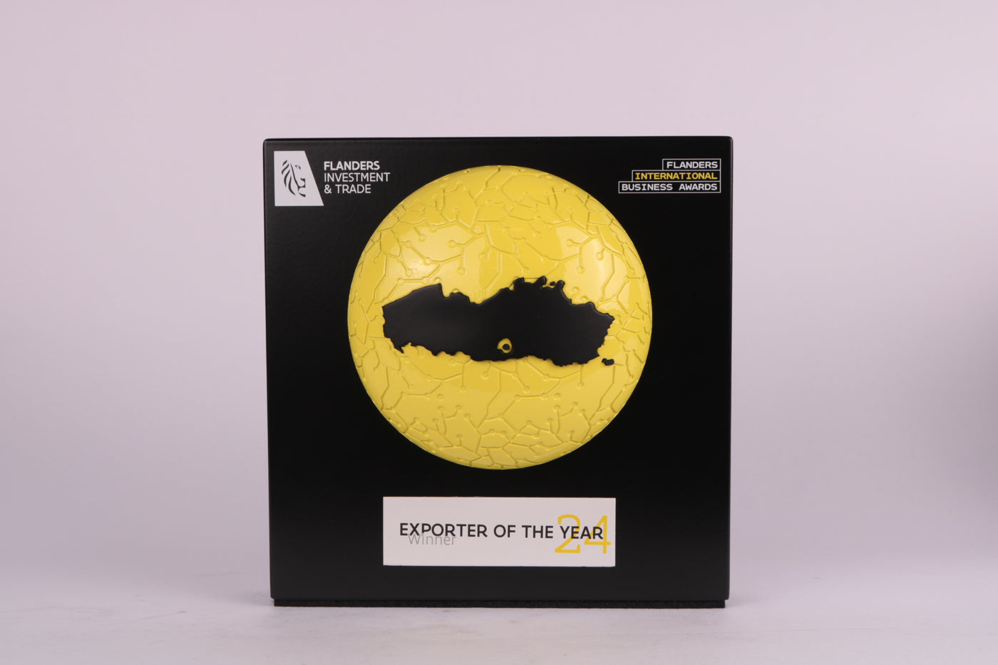 black trophy with a yellow sphere for the exporter of the year