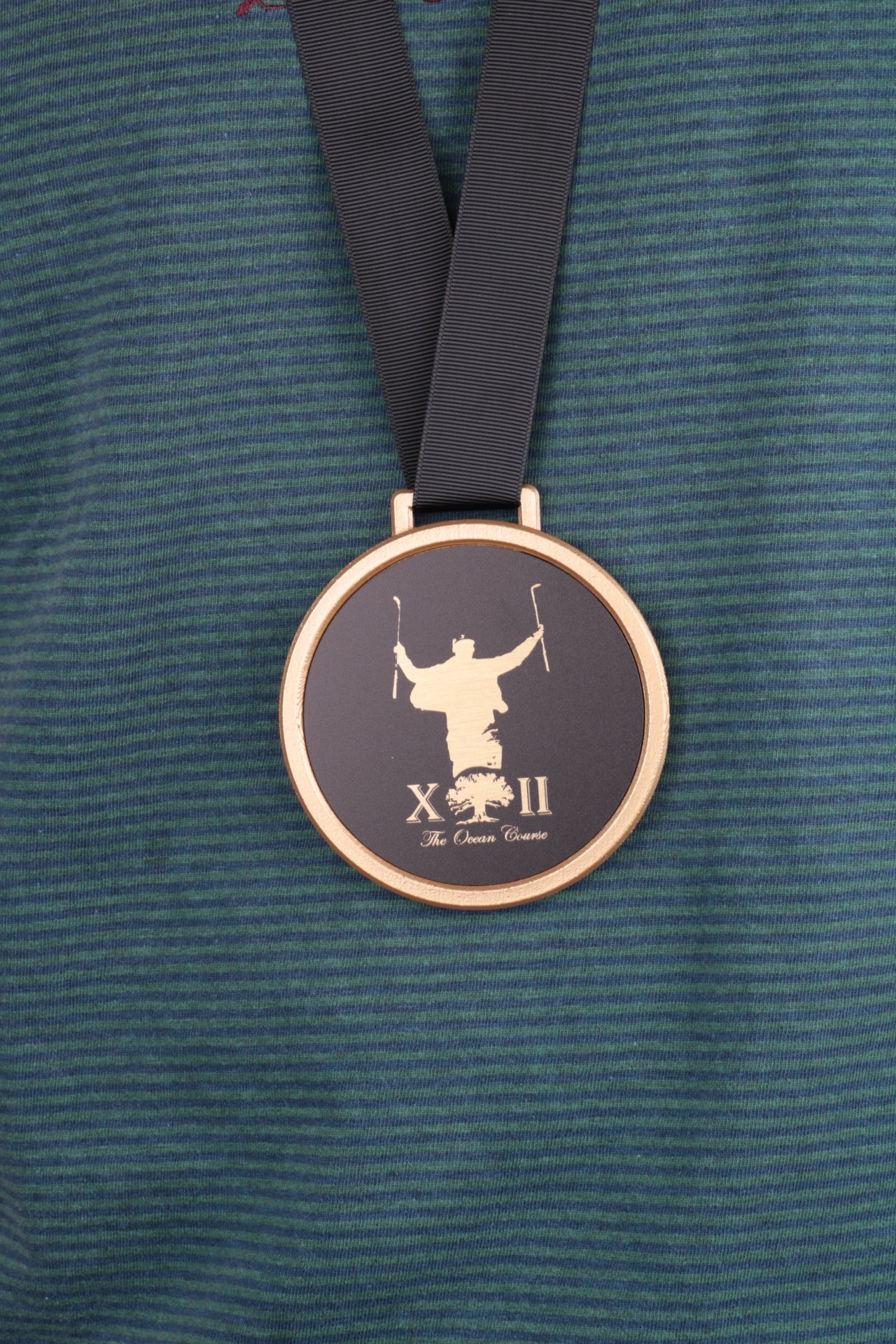 golf medal with matte black print on brass plate in gold 3d printed holder on black ribbon