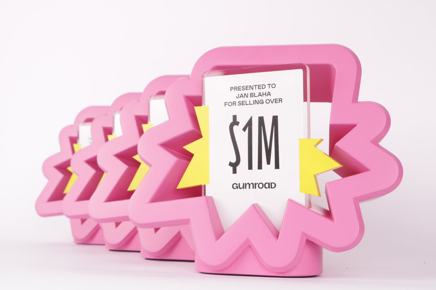 pink 3d printed figure with an acrylic design in the centre