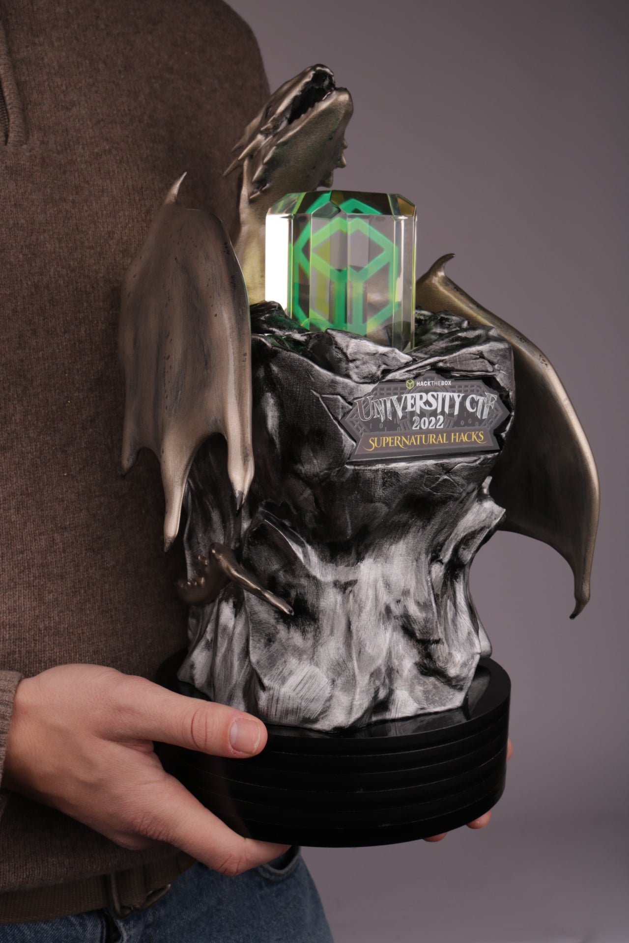 black base with a 3d printed stand and a golden dragon for hack the box