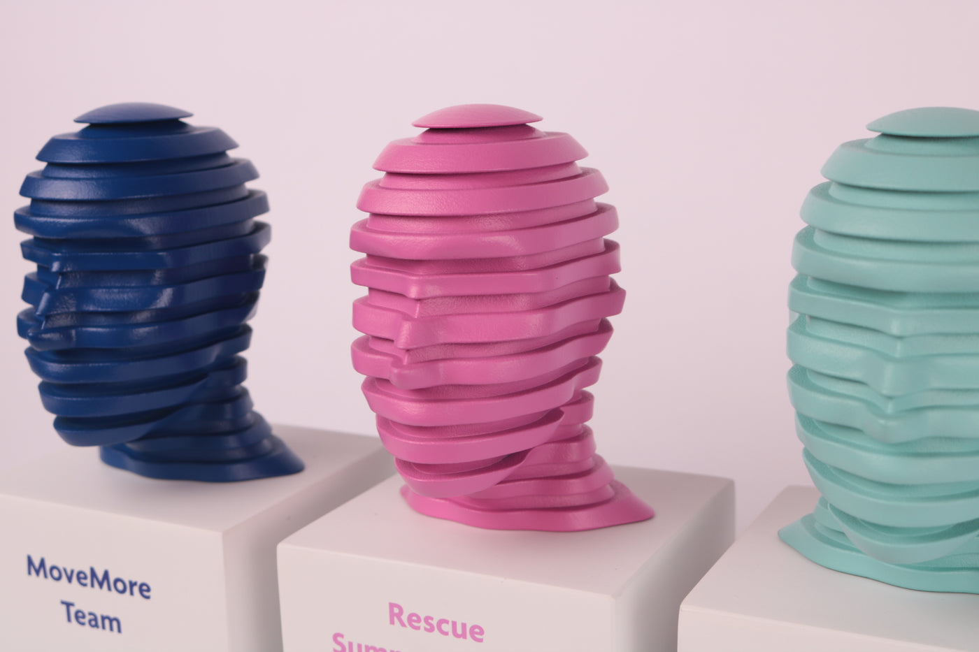 concrete trophy with 3d printed heads on top