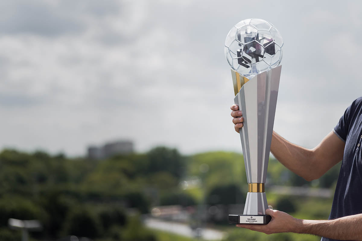 aluminium and gold trophy with a glass ball on top