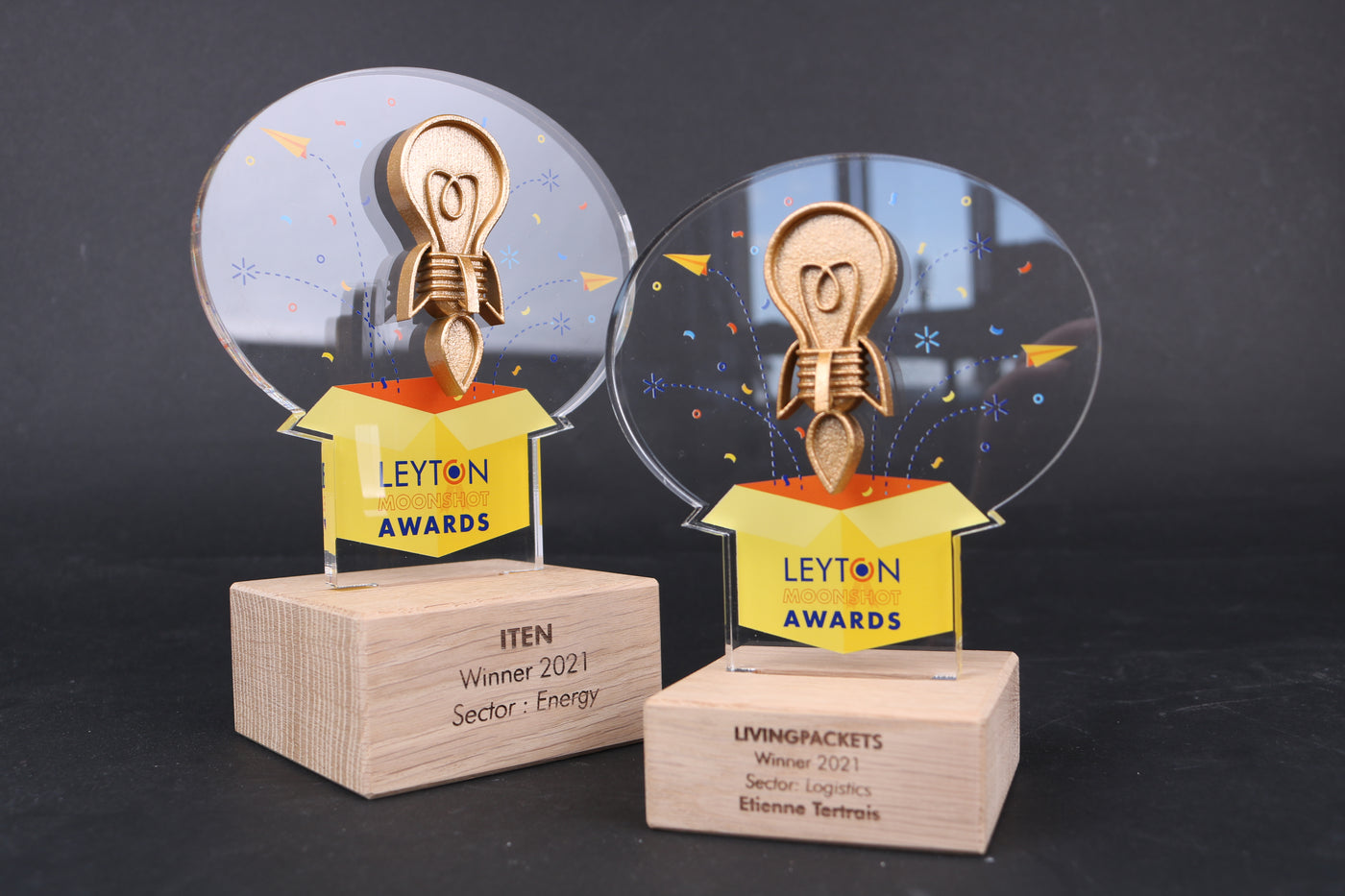 wooden trophy base with an acrylic design for leyton moonshots awards