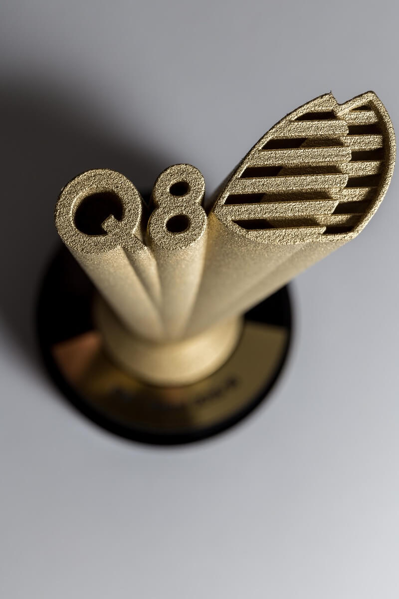 golden 3d printed logo for q8