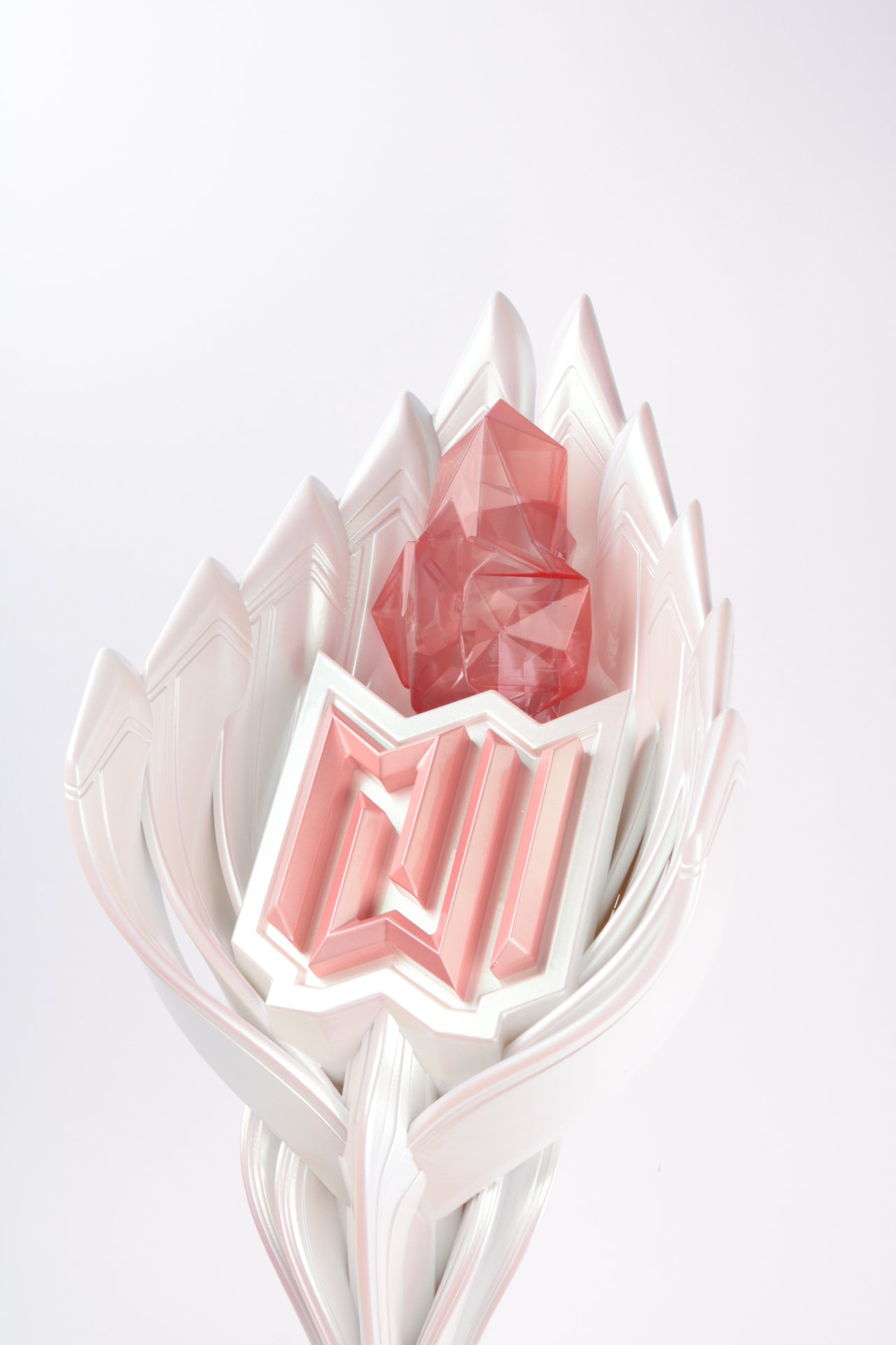 close-up of pearlescent white throphy shaped like sea shells with soft pink details