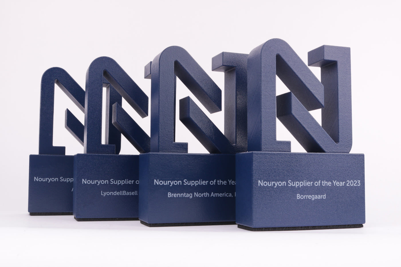 blue trophy with a 3d printed logo of nouryon