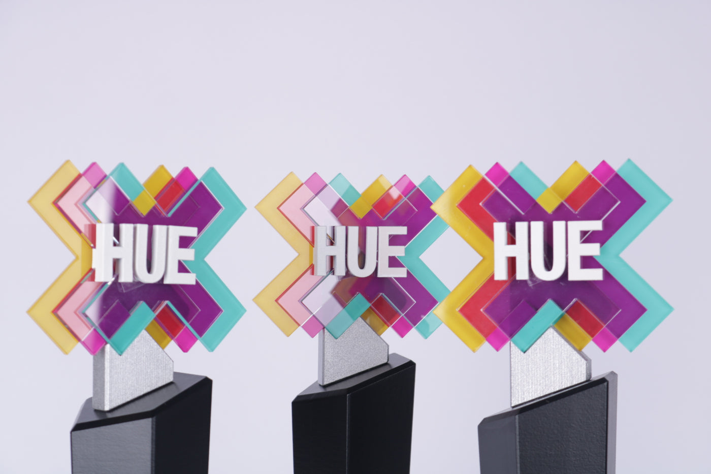 black trophy stand with a colorfull logo for hue