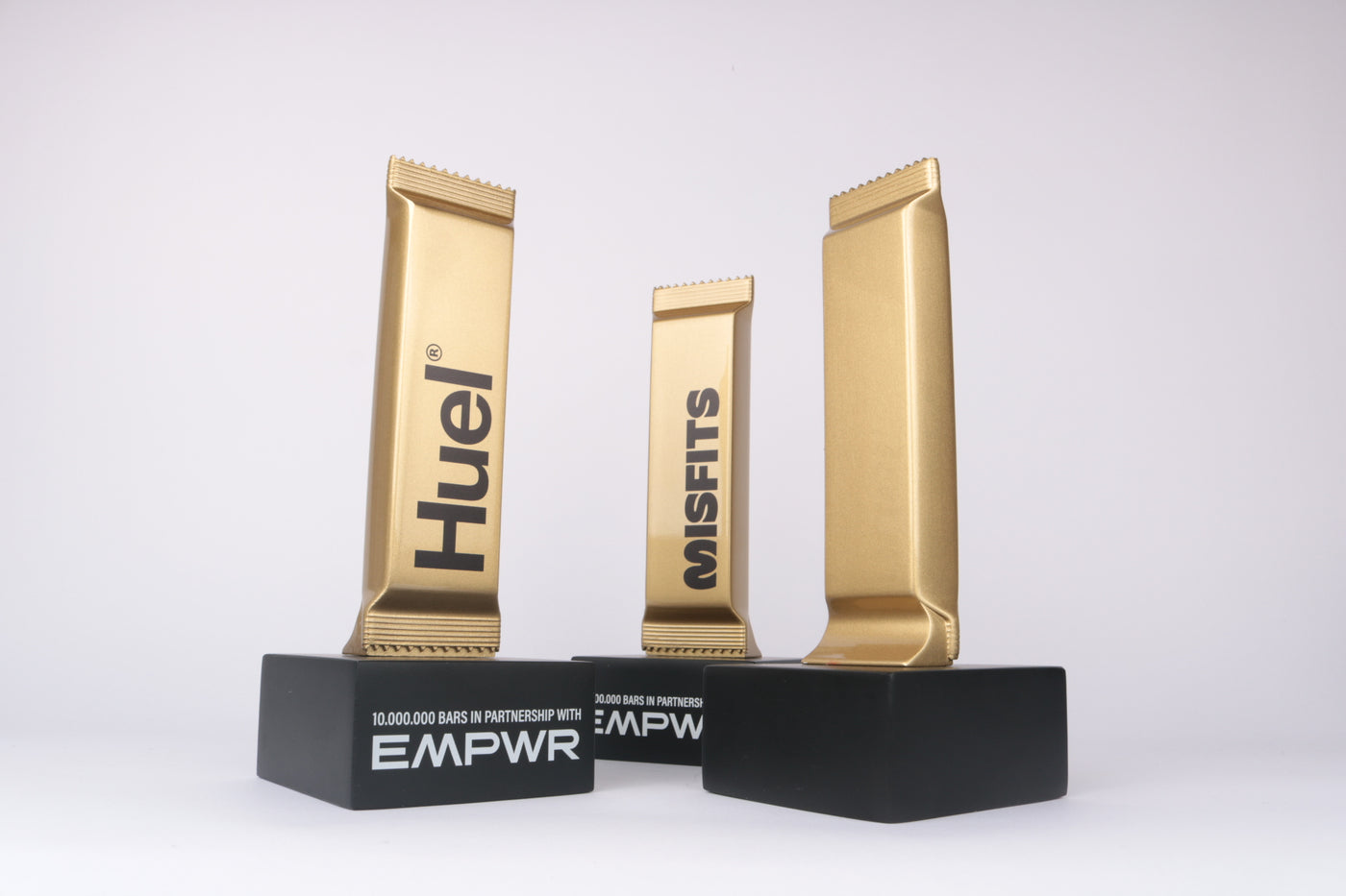 protein bar trophy wrappers gold metallic glossy finish on black base logo graphics