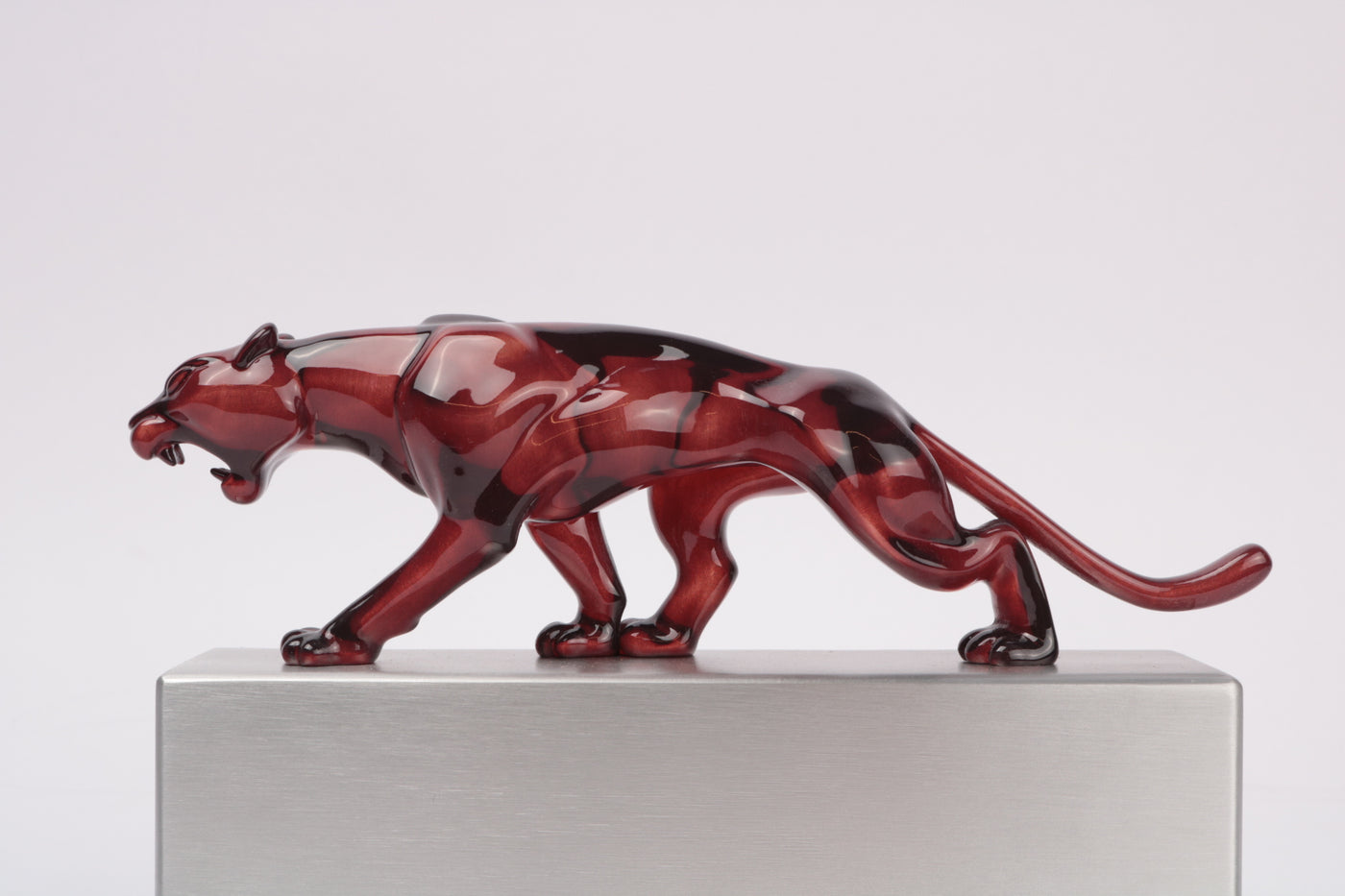 side profile of cherry red resin panther award transparent 3d print on brushed aluminium base