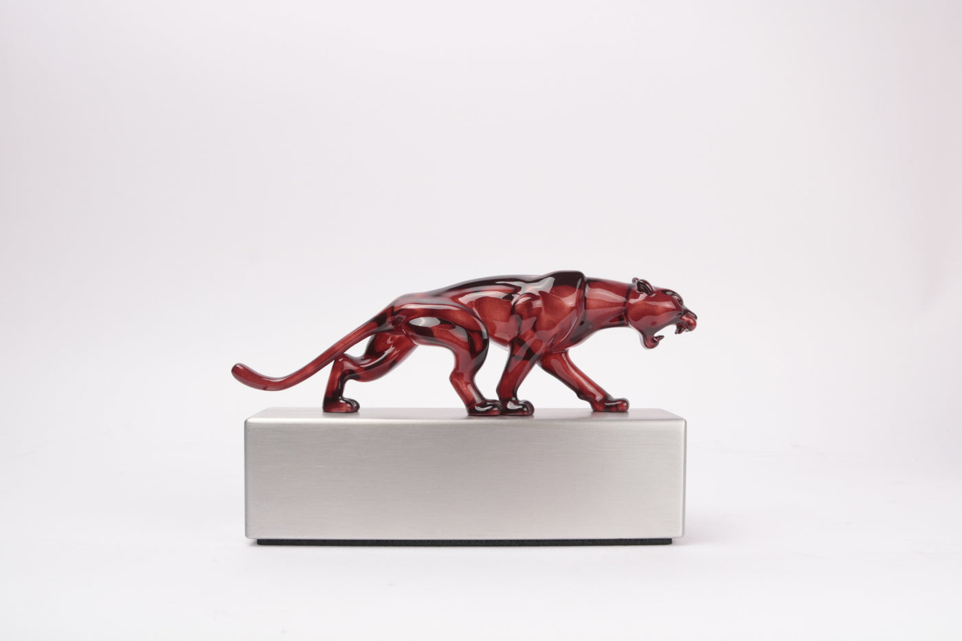 side profile of cherry red resin panther award transparent 3d print on brushed aluminium base