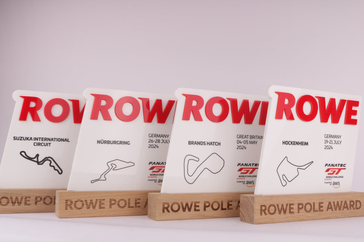 wooden trophy base with an acrylic design of the track