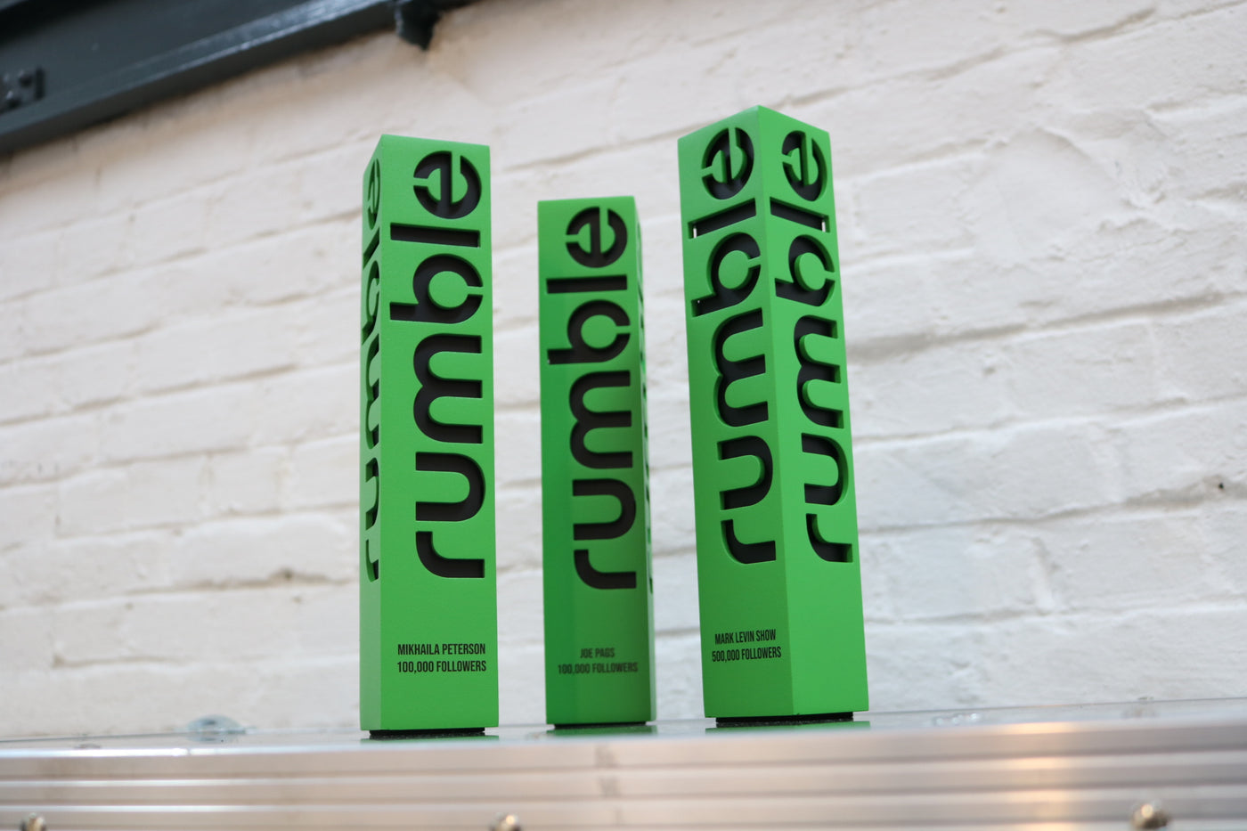 green trophies for the rumble content awards