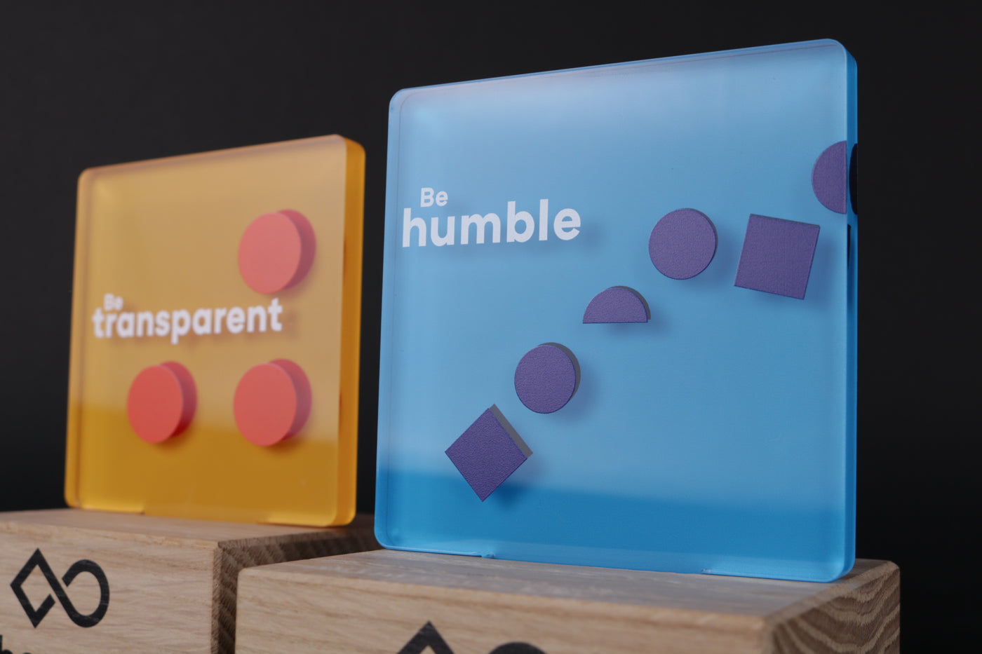 wooden trophy base with an acrylic logo design