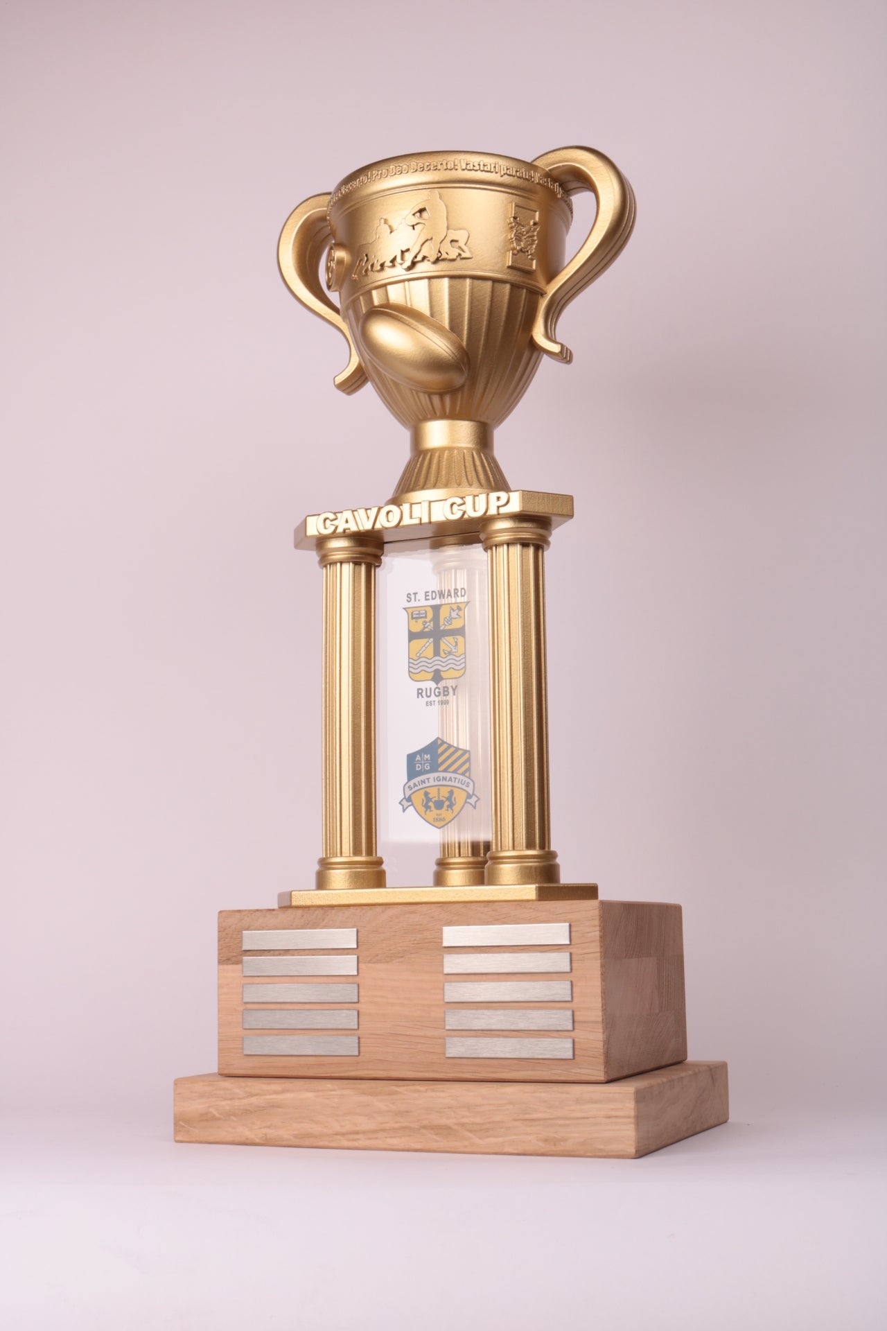 golden 3d printed trophy with a wooden base