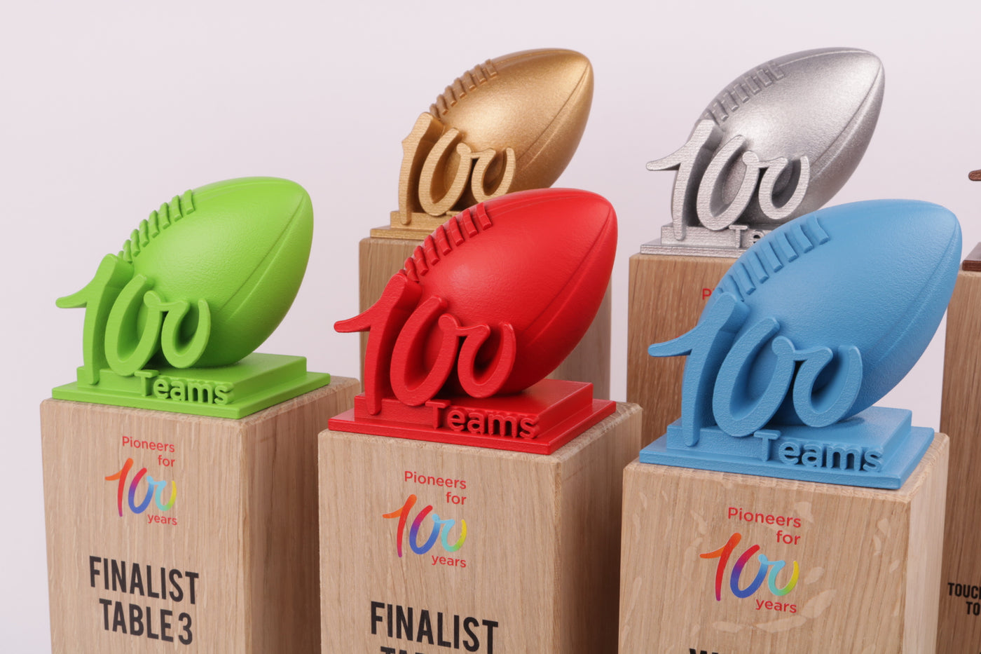 wooden trophy bases with colerfull rugby balls 
