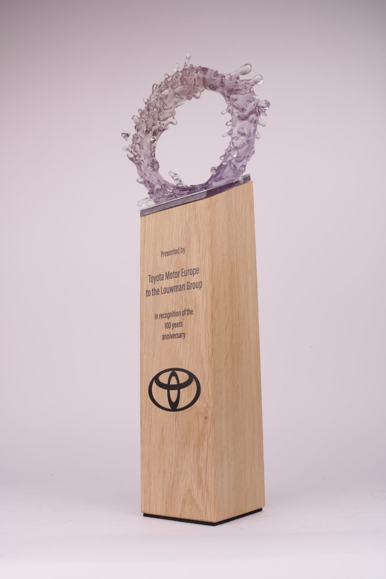 wooden trophy base with the toyota logo and a 3d printed circle on top