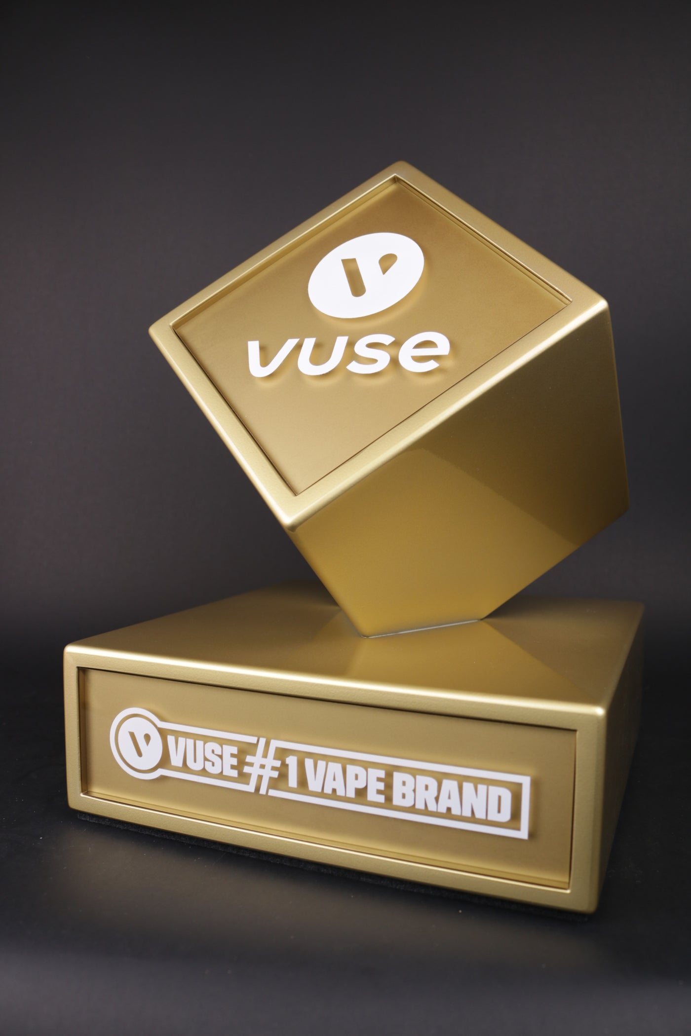 Golden trophy with a golden cube for vuse
