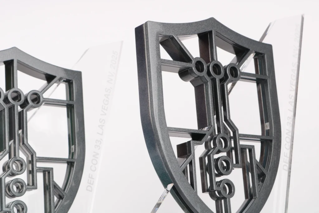 aixcc the difference shield bespoke trophy hackers cyber acrylic glossy metallic pearlescent paint close up 2025