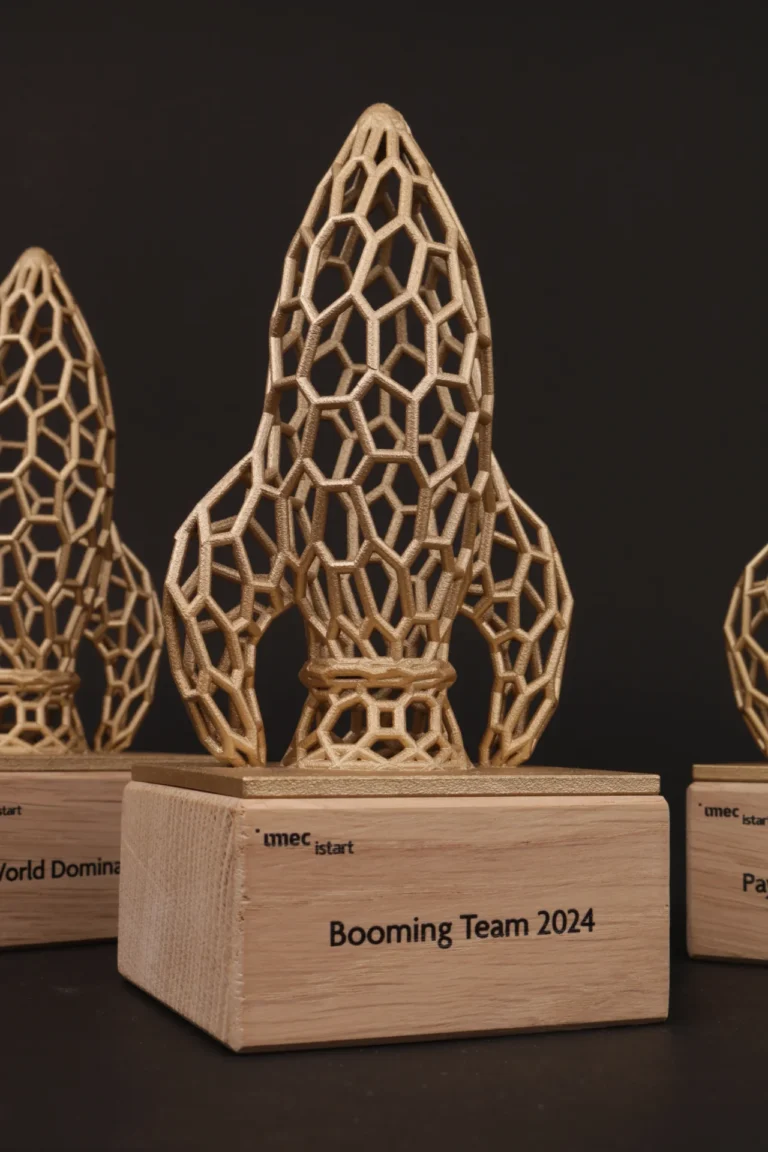 Gold lattice rocket figures on oak bases for the imec iStart Rocket Awards 2024