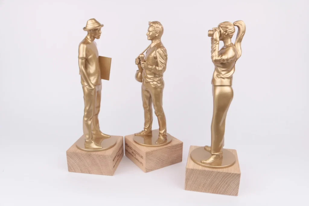megalizzi character figurines glossy gold bespoke awards oak base engraving 2025