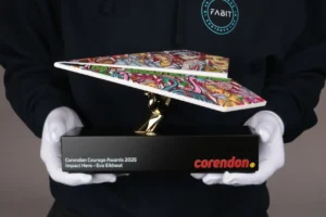 Corendon Courage Awards 2025 Impact Hero corporate trophy with an illustrated paper plane, held by its base