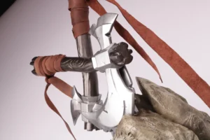 Close-up of the chrome axe heads and leather wrapped handles on the PGL Wallachia esports trophy