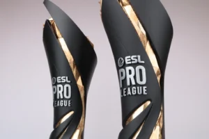 Close-up of two black ESL Pro League esports trophies with twisting gold accents
