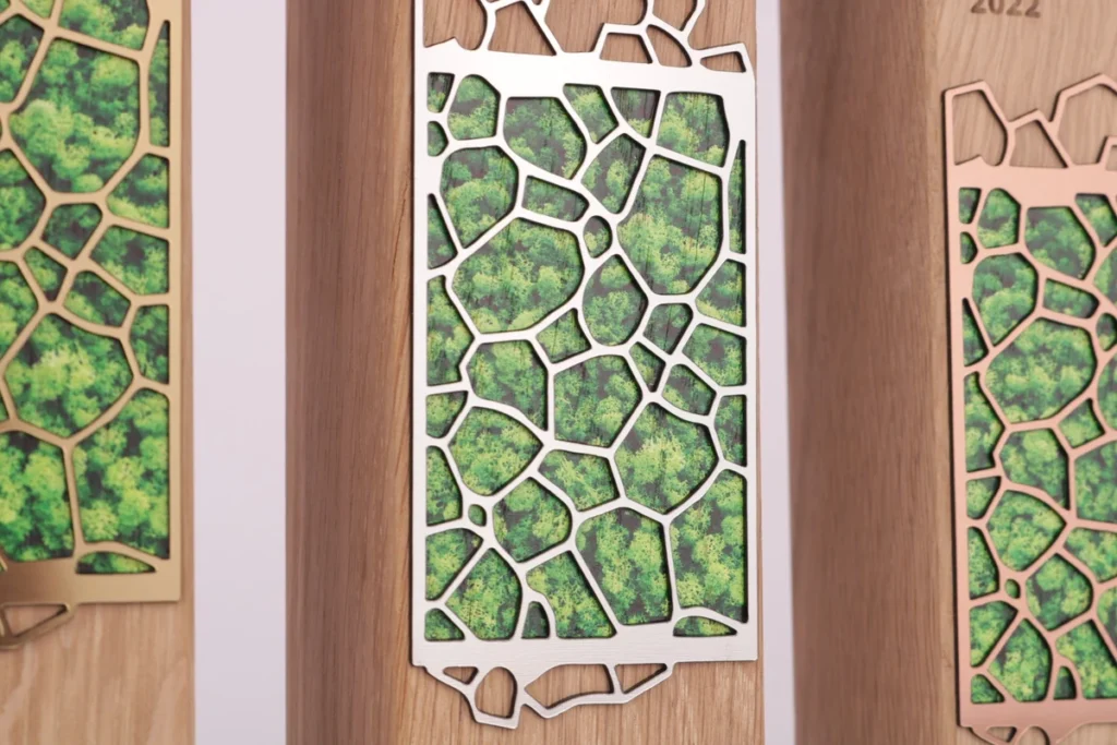 FSC-certified oak awards with moss inlay behind metal fretwork