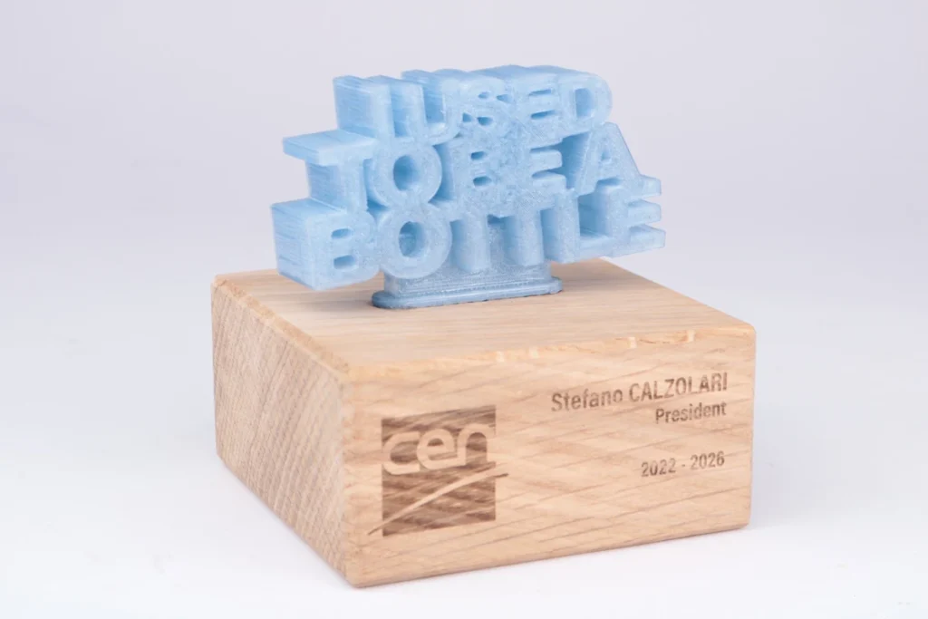 I used to be a bottle: recycled PET award on laser-engraved oak block