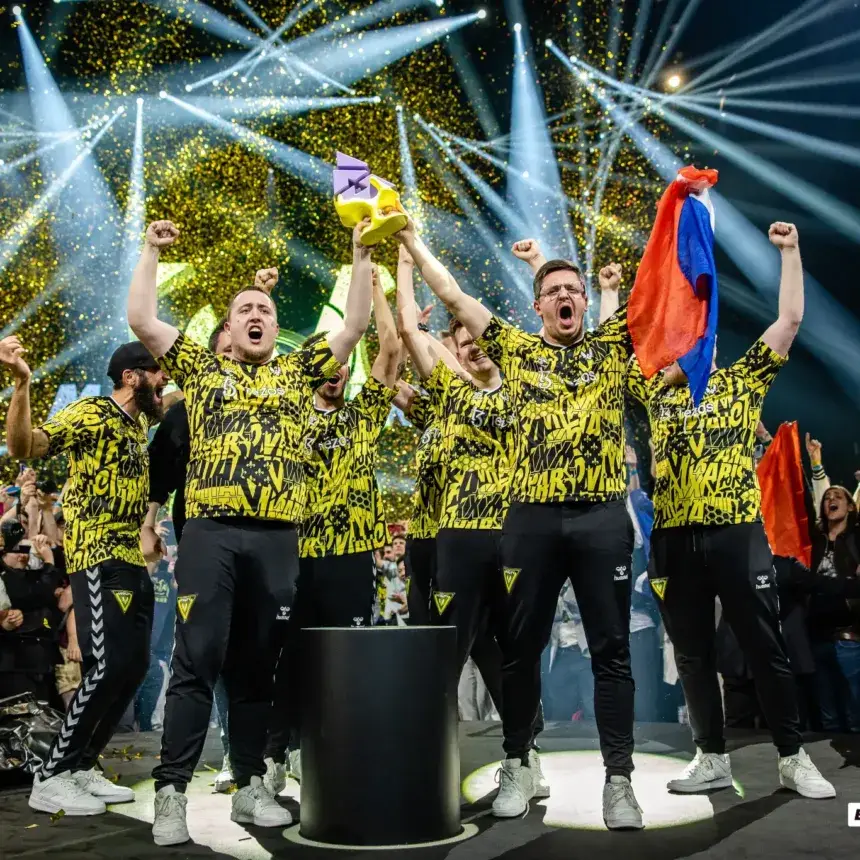 Esports team lifting a trophy on stage at the BLAST.tv Paris Major, trophy by Fabit