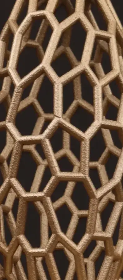 Close-up of the gold 3D printed lattice of a rocket trophy, made by Fabit